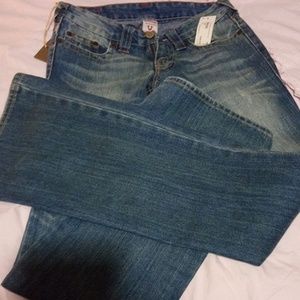 TRUE RELIGION boot cut blue jeans.